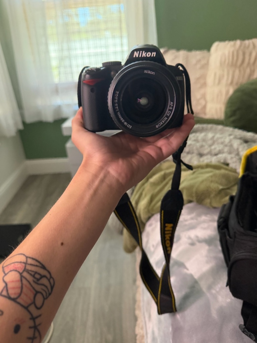 Nikon DSLR Camera in Black with Yellow-Trim Strap
